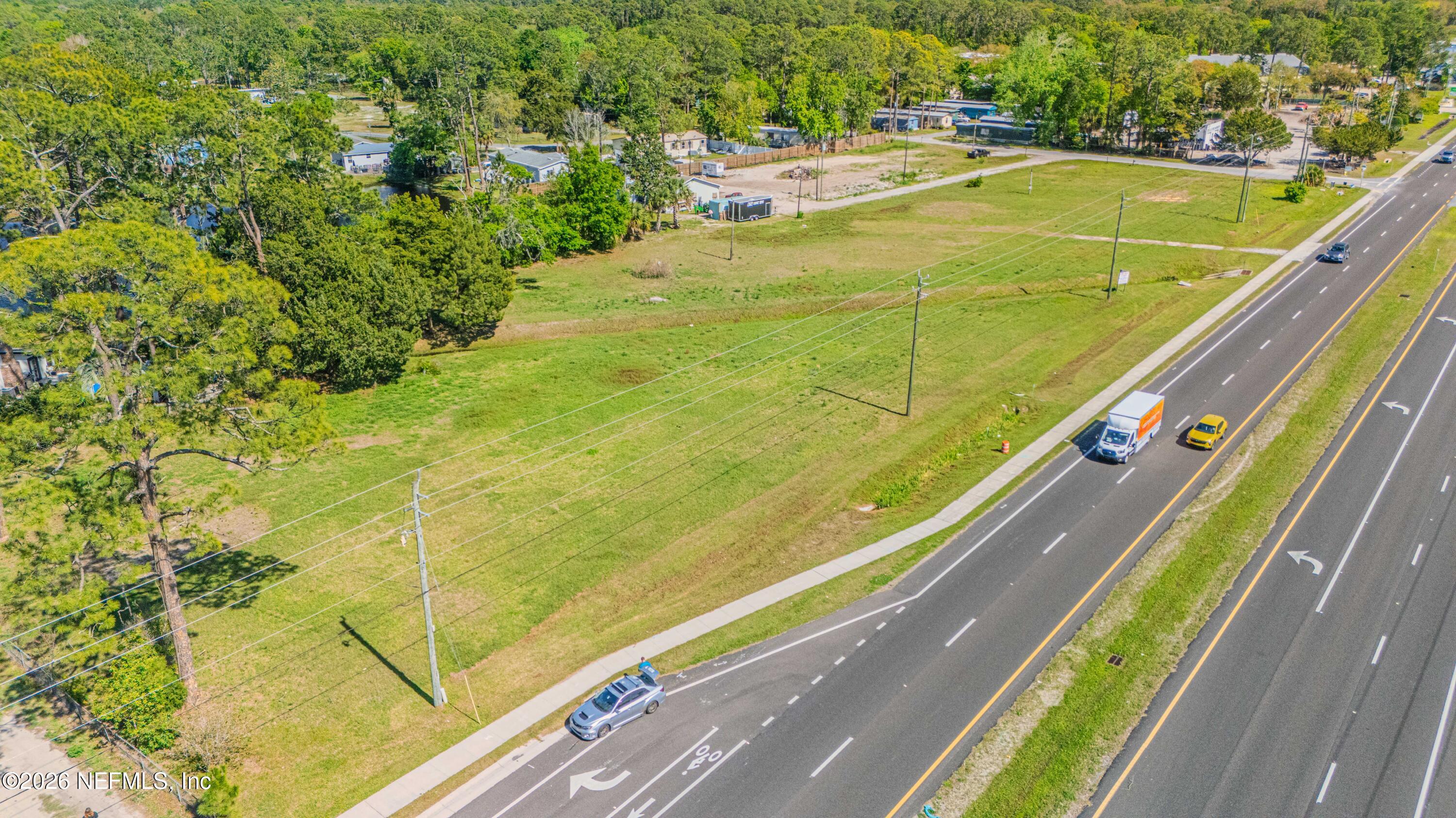 6550 Highway 1 St. Augustine, FL 32095 - Photo 5 of 6 a view of a swimming pool with a yard