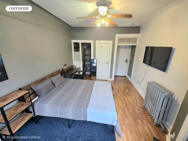 a bed room with a bed and a television