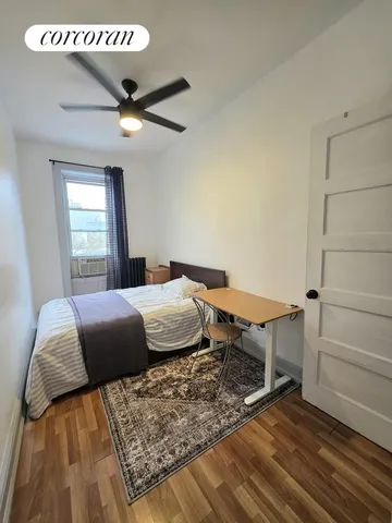 a bedroom with a bed and a table