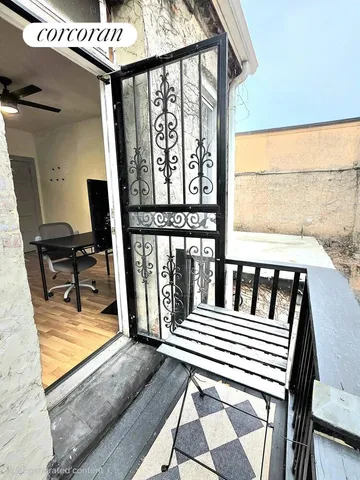 a view of a chairs and a table in the balcony