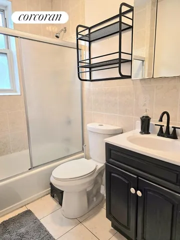 a bathroom with a sink a toilet and a shower