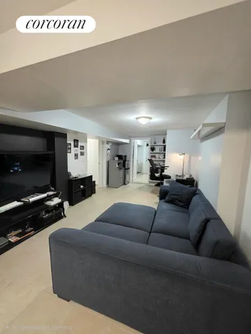a living room with furniture a flat screen tv and a couch