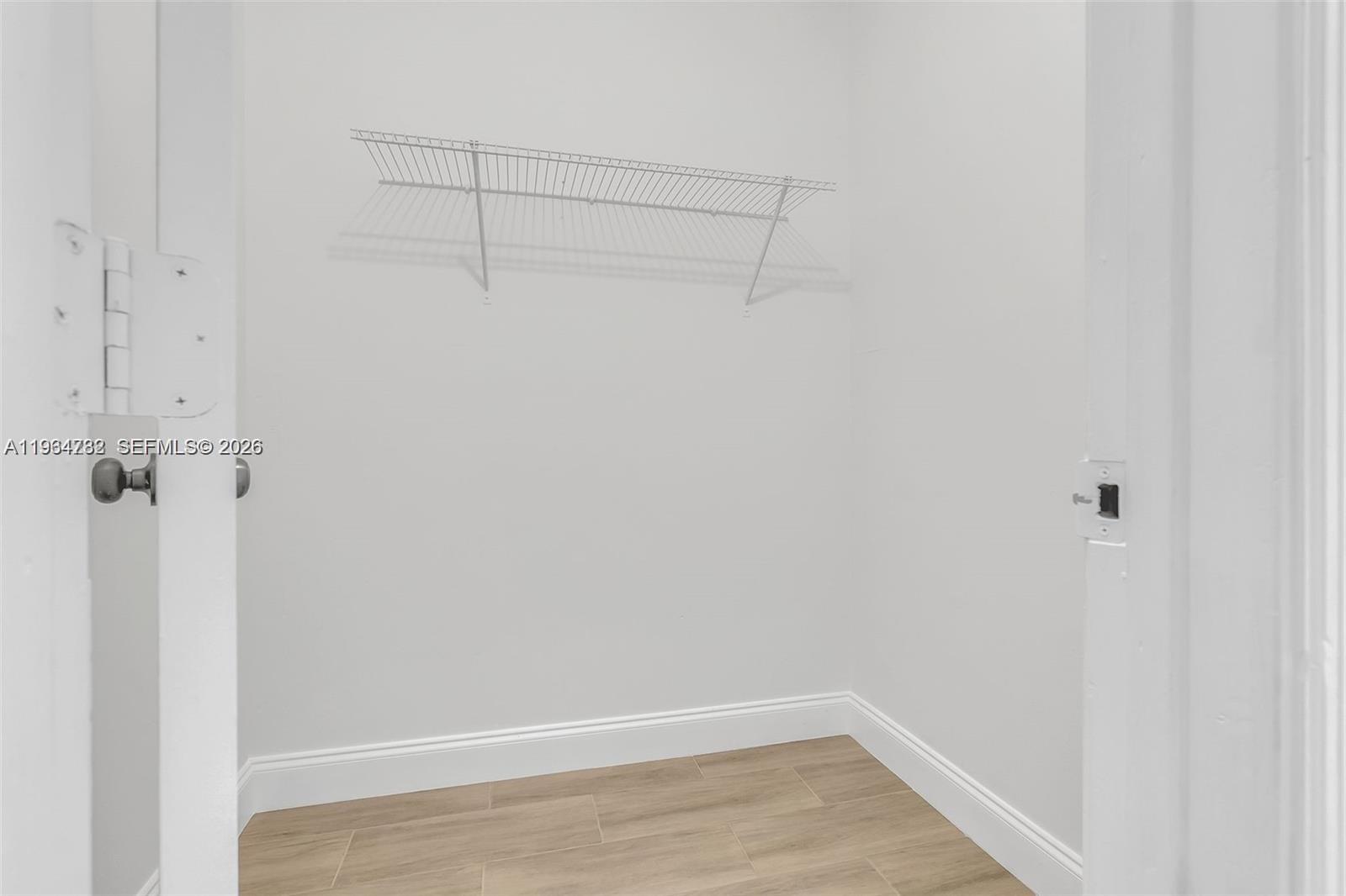2501 Riverside Drive, Unit 307A Coral Springs, FL 33065 - Photo 15 of 29 a view of a room with racks on the wall
