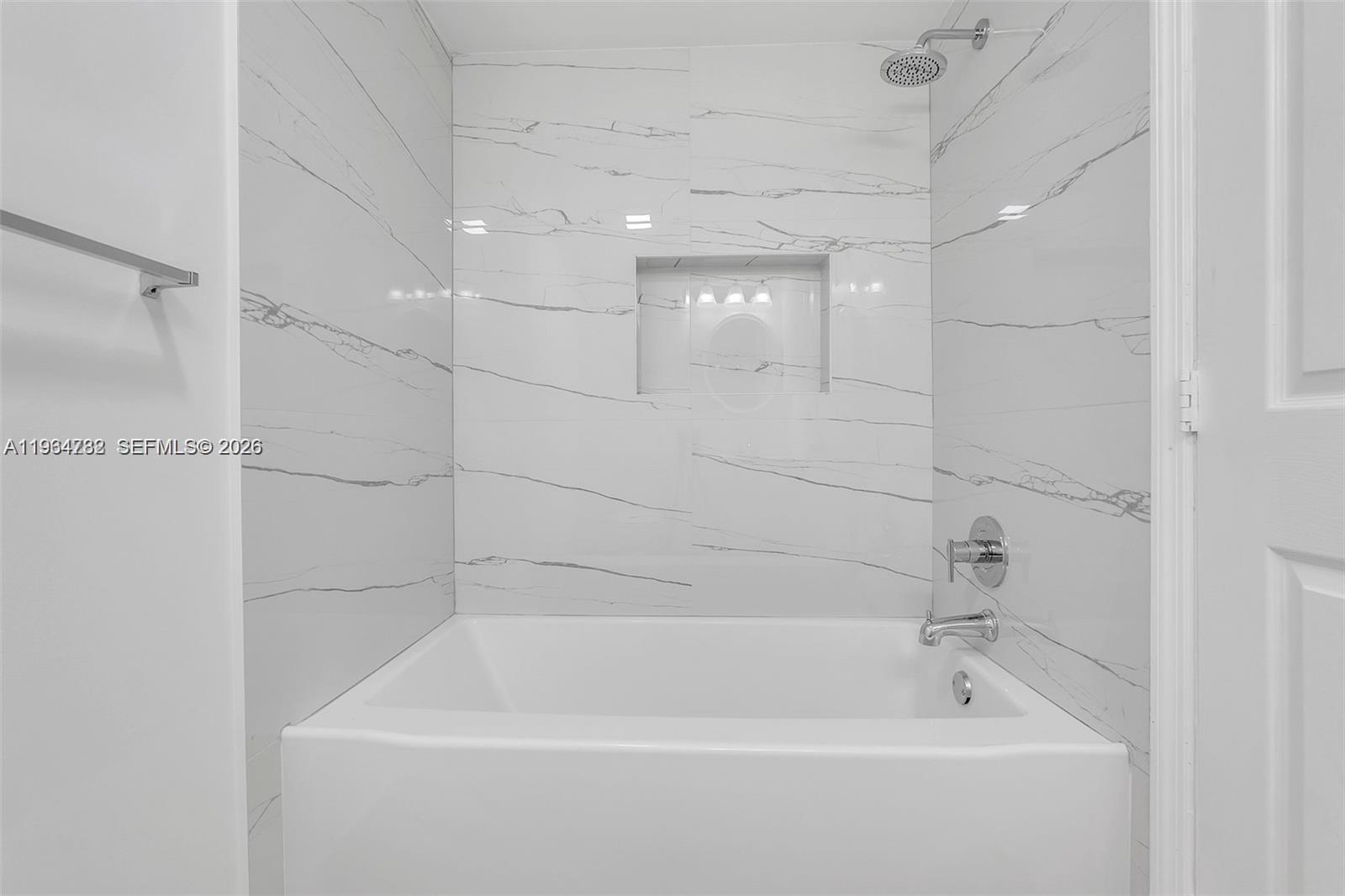 2501 Riverside Drive, Unit 307A Coral Springs, FL 33065 - Photo 16 of 29 a bathroom with a bathtub