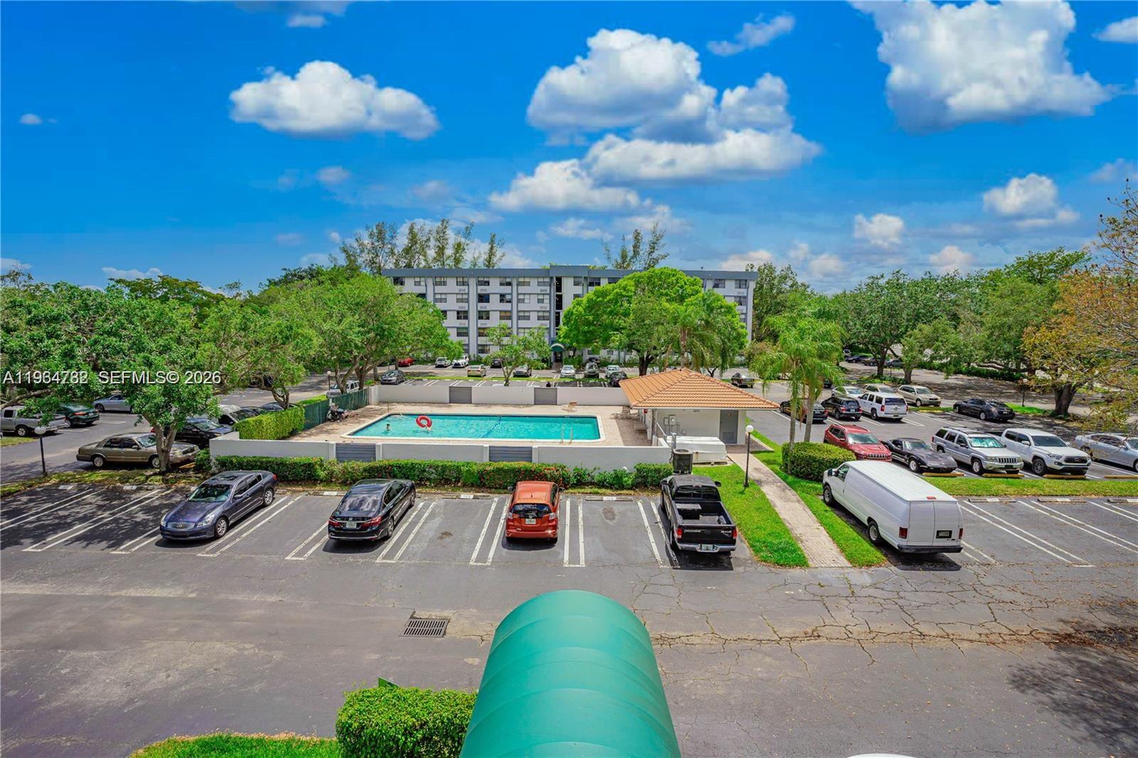 2501 Riverside Drive, Unit 307A Coral Springs, FL 33065 - Photo 22 of 29 a childrens park with lots of swings slides and swimming pool