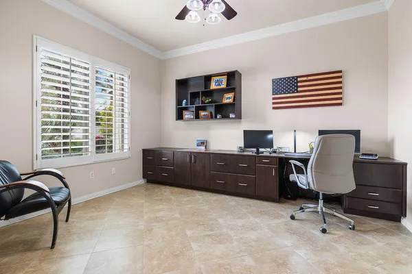 a workspace with furniture and a window