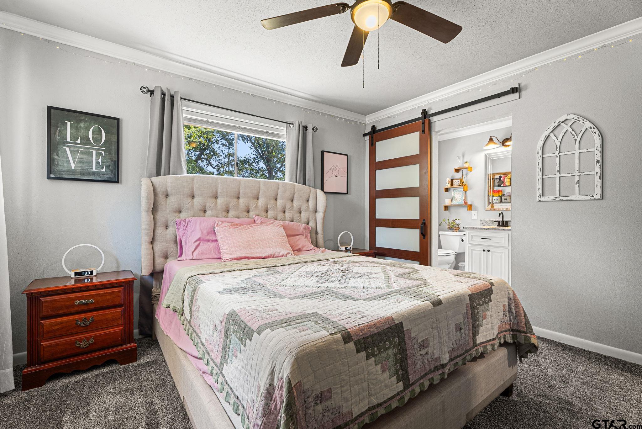 3200 Charron Avenue Longview, TX 75601 - Photo 13 of 34 a bedroom with a bed and a window