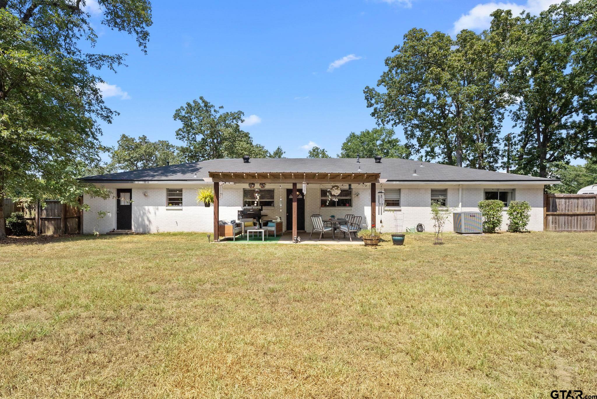 3200 Charron Avenue Longview, TX 75601 - Photo 27 of 34 front view of a house with a big yard