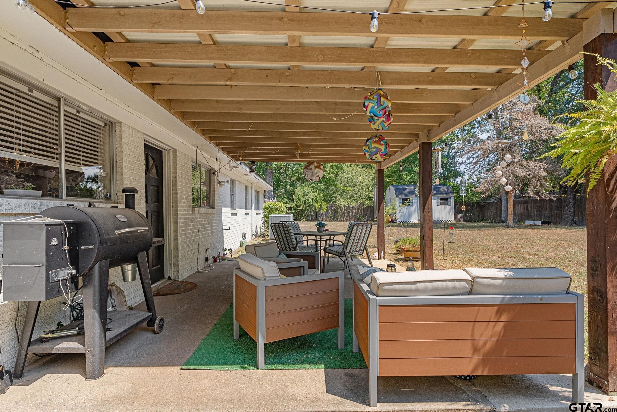 3200 Charron Avenue Longview, TX 75601 - Photo 28 of 34 a outdoor living space with patio furniture and a grill