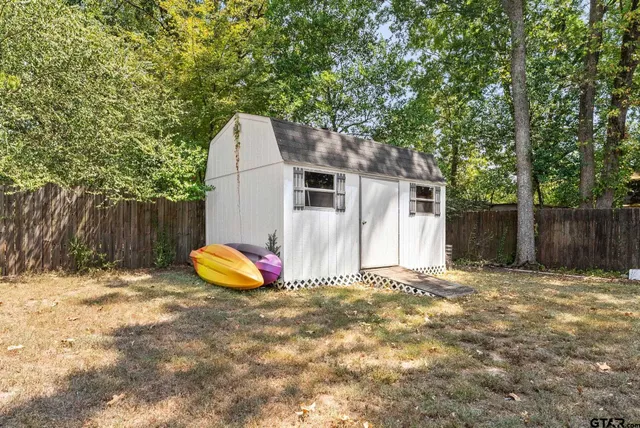 an aerial view of residential house with space and trees all around