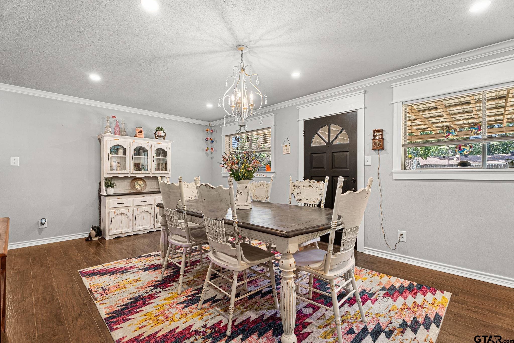 3200 Charron Avenue Longview, TX 75601 - Photo 7 of 34 a view of a dining room with furniture and wooden floor