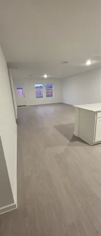 a view of a kitchen with a sink and a stove top oven