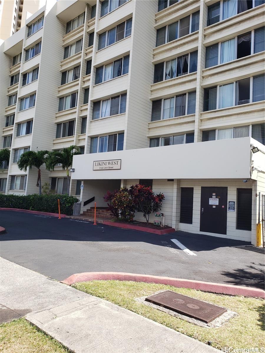 5122 Likini Street, Unit 716 Honolulu, HI 96818 - Photo 1 of 9 a front view of a building with a garden