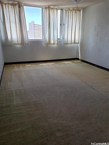 a white toilet sitting next to a bath tub