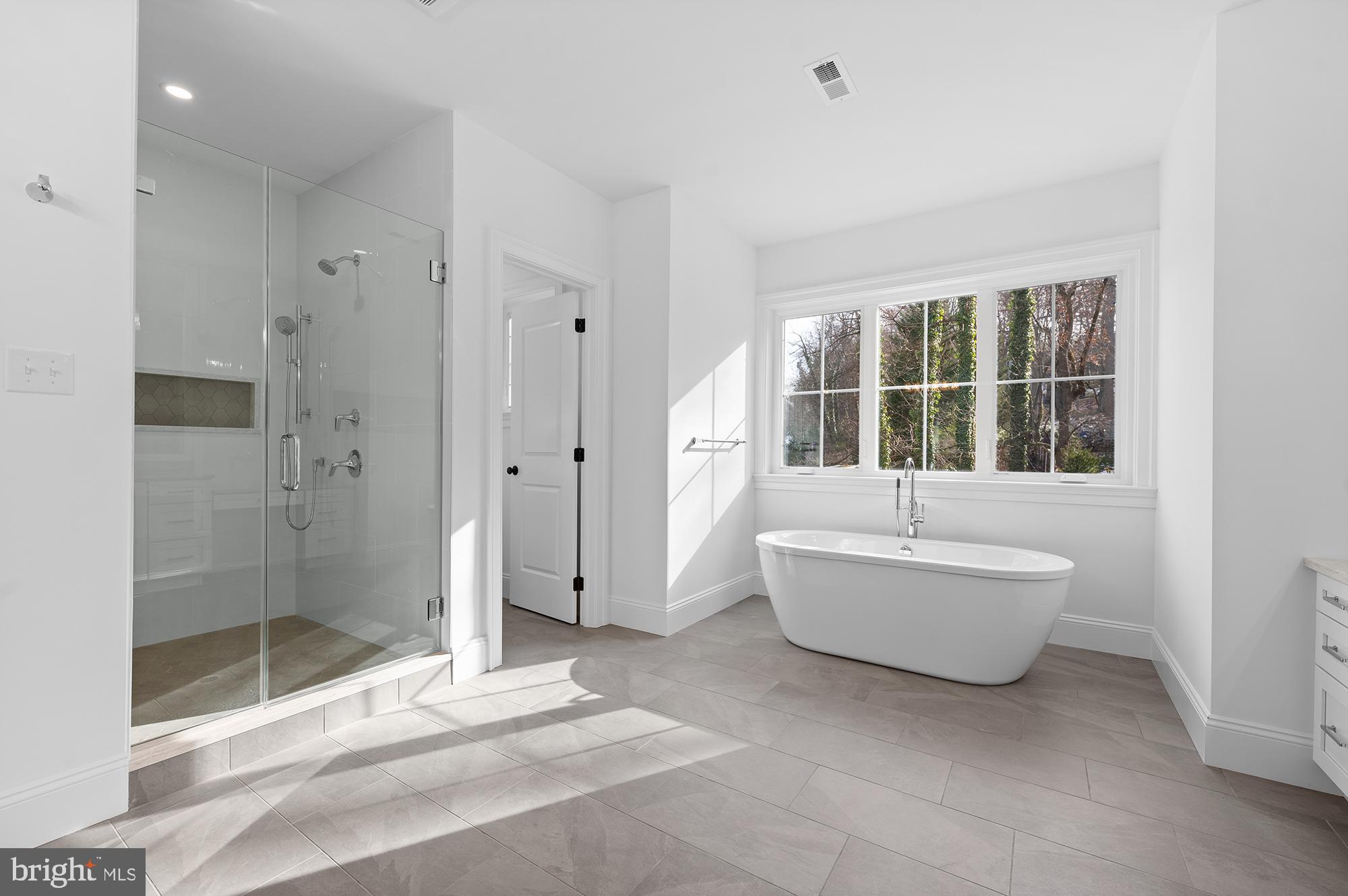 1344 East Meetinghouse Road Lower Gwynedd, PA 19002 - Photo 12 of 12 a spacious bathroom with a bathtub and shower