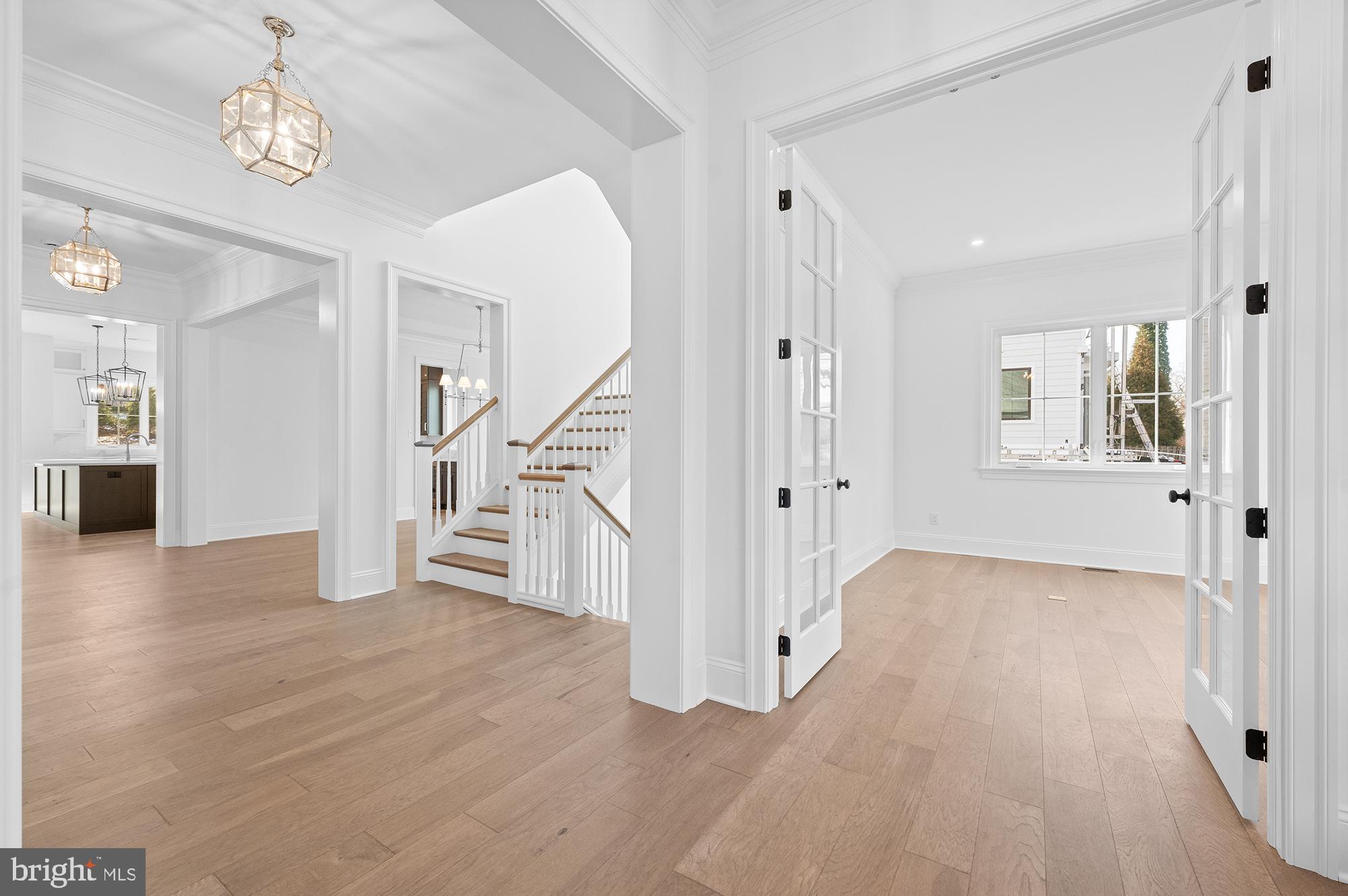 1344 East Meetinghouse Road Lower Gwynedd, PA 19002 - Photo 7 of 12 a view of a livingroom with wooden floor and stairs