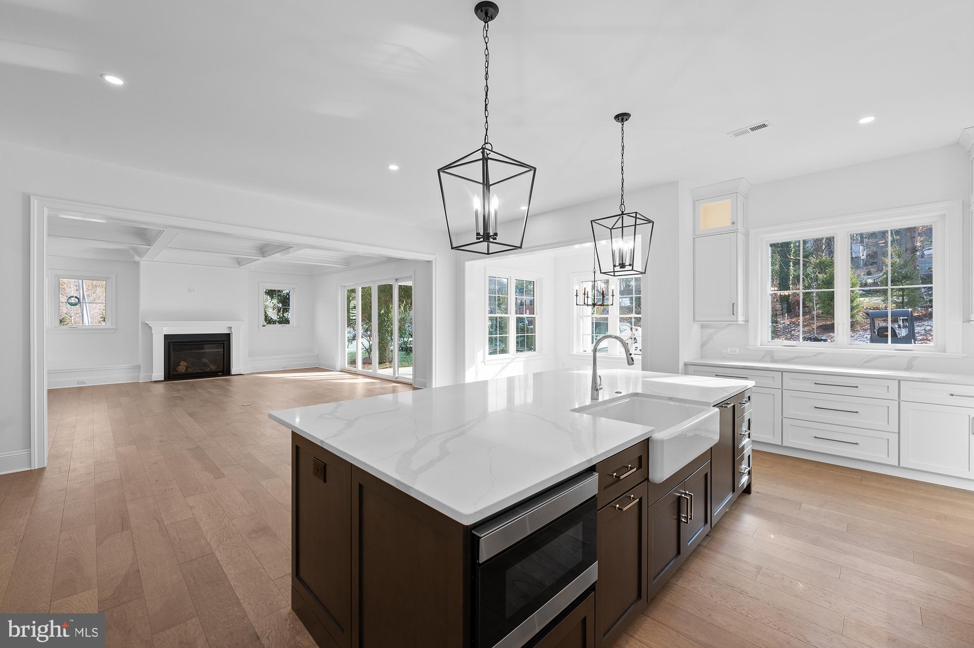 1344 East Meetinghouse Road Lower Gwynedd, PA 19002 - Photo 10 of 12 a kitchen with a stove center island and windows