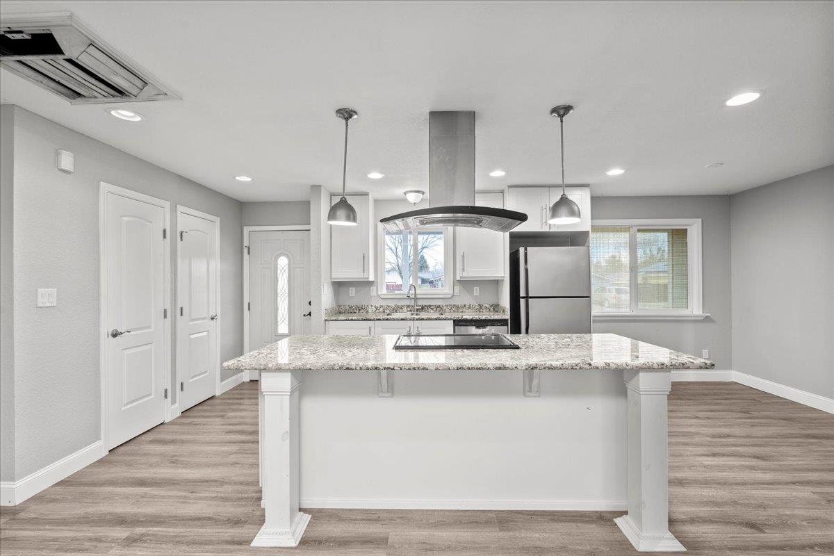 20381 Nashua Road Sonora, CA 95370 - Photo 9 of 27 a large kitchen with kitchen island stainless steel appliances counter space and a sink