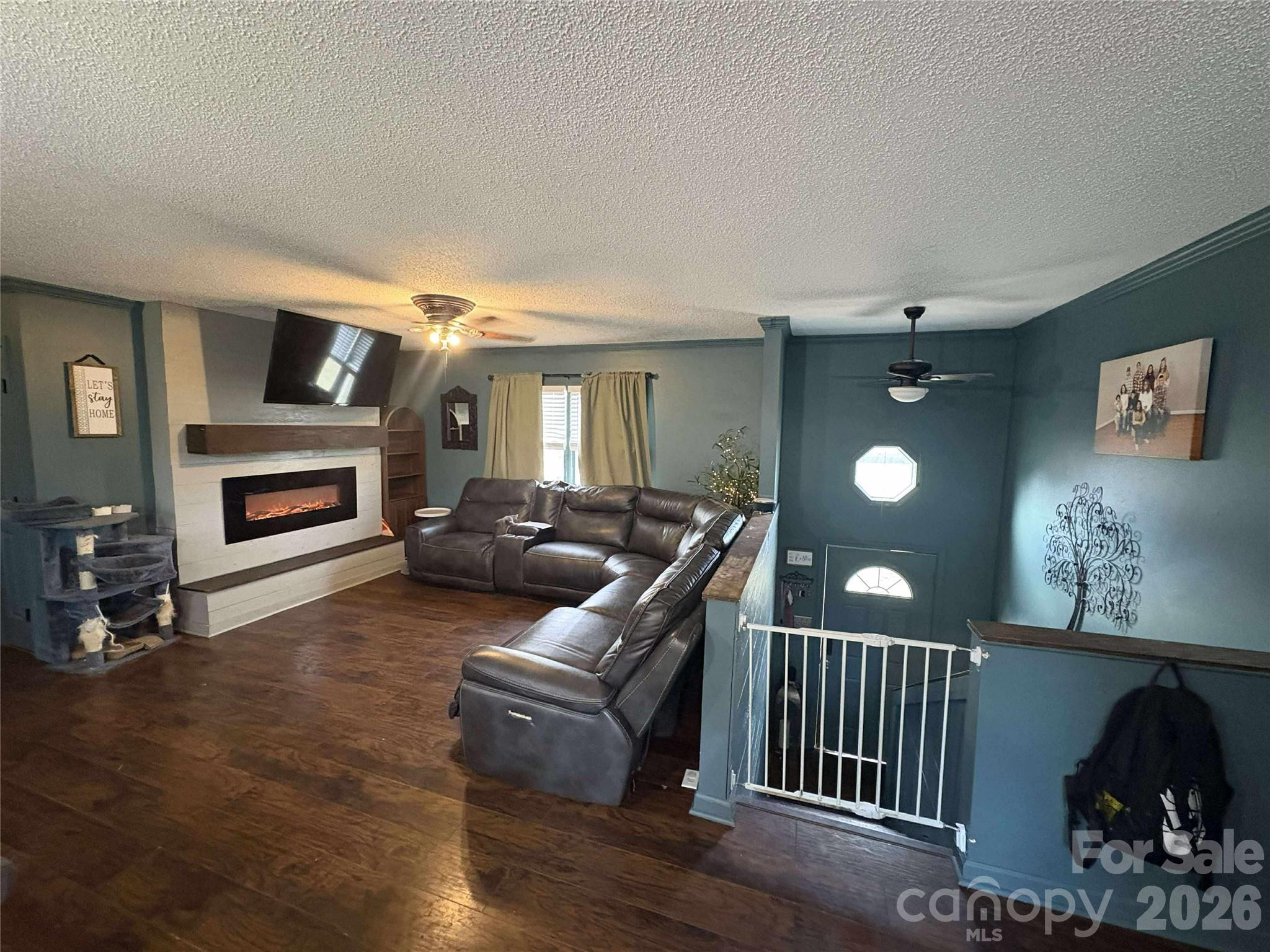 4132 Lower Cedar Valley Road Hudson, NC 28638 - Photo 2 of 5 a living room with furniture and a fireplace
