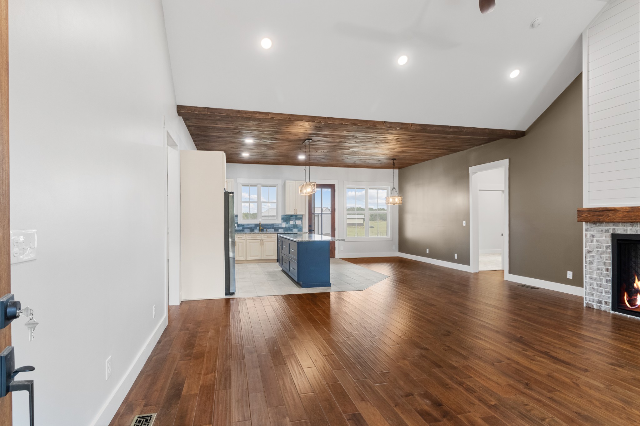 136 Summer Lk Drive Summertown, TN 38483 - Photo 14 of 48 a view of a big room with wooden floor and a kitchen