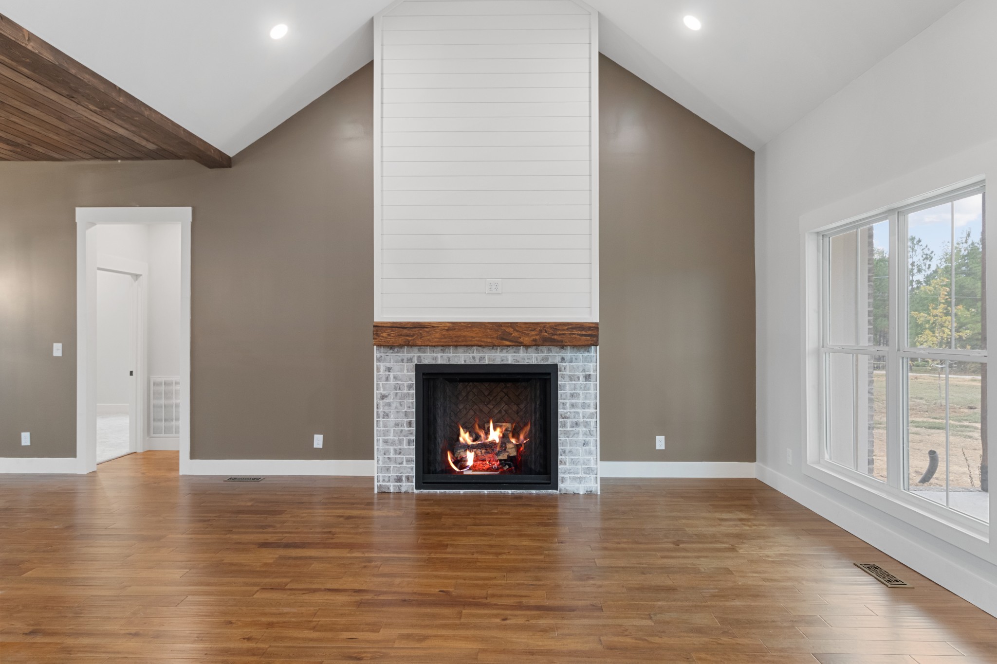 136 Summer Lk Drive Summertown, TN 38483 - Photo 15 of 48 a view of an empty room with wooden floor fireplace and a window