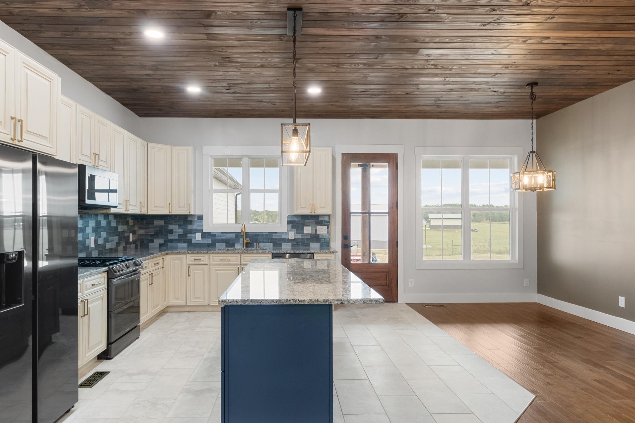 136 Summer Lk Drive Summertown, TN 38483 - Photo 17 of 48 a large kitchen with kitchen island a sink stainless steel appliances and cabinets