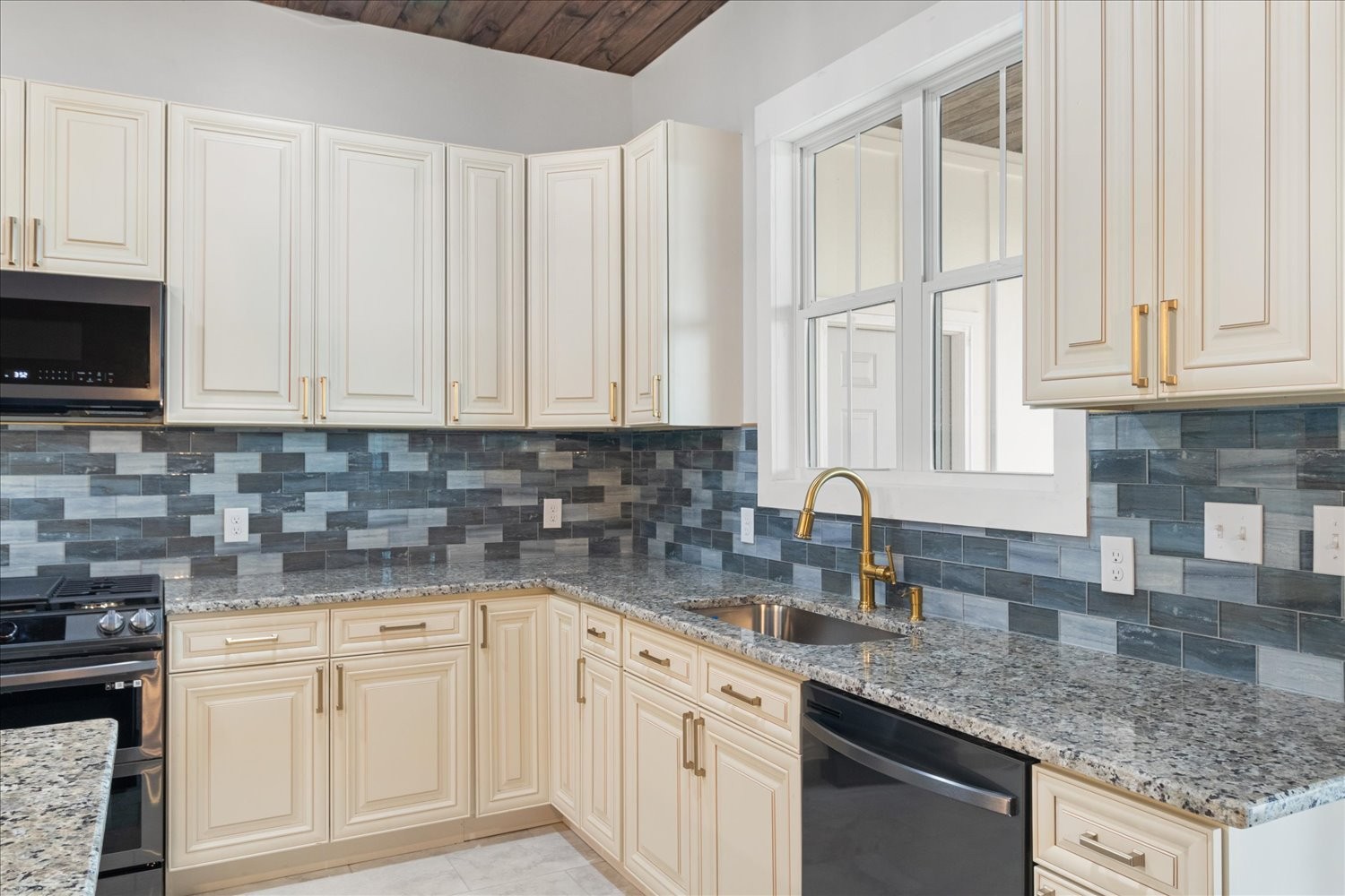 136 Summer Lk Drive Summertown, TN 38483 - Photo 21 of 48 a kitchen with granite countertop white cabinets and sink