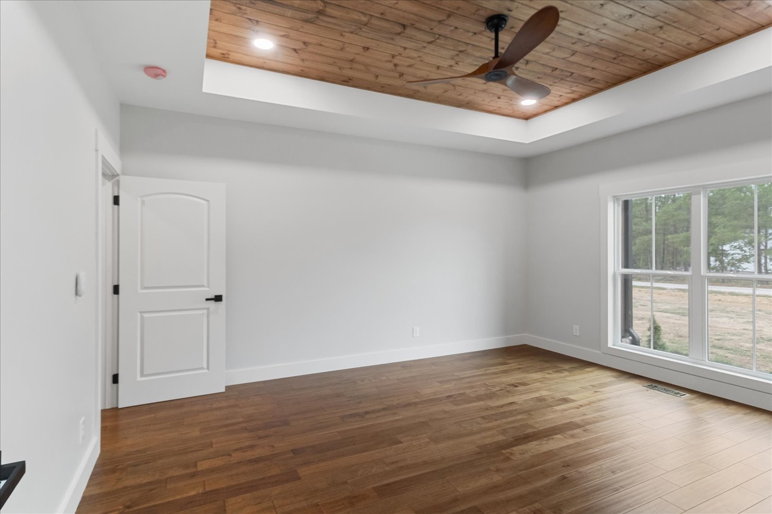 136 Summer Lk Drive Summertown, TN 38483 - Photo 25 of 48 a view of an empty room with wooden floor and a window