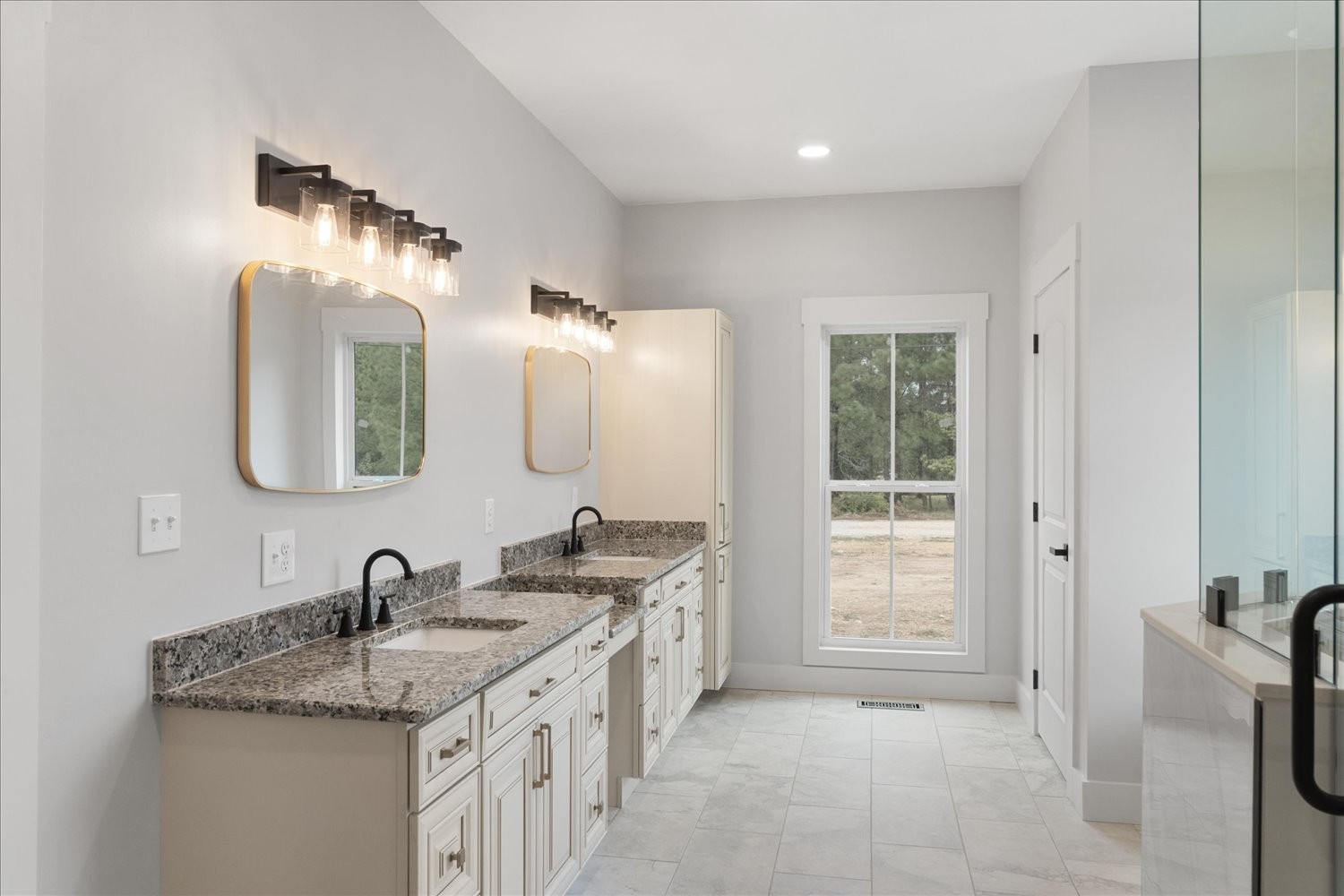 136 Summer Lk Drive Summertown, TN 38483 - Photo 28 of 48 a bathroom with a double vanity sink a mirror and a shower