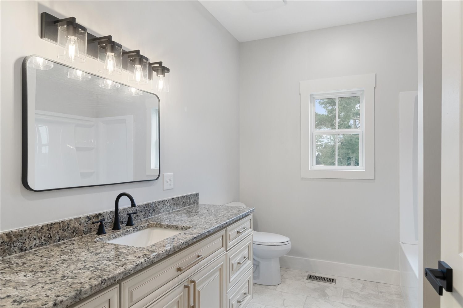 136 Summer Lk Drive Summertown, TN 38483 - Photo 35 of 48 a bathroom with a granite countertop toilet sink and mirror