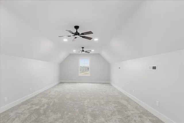 an empty room with a empty space and a ceiling fan