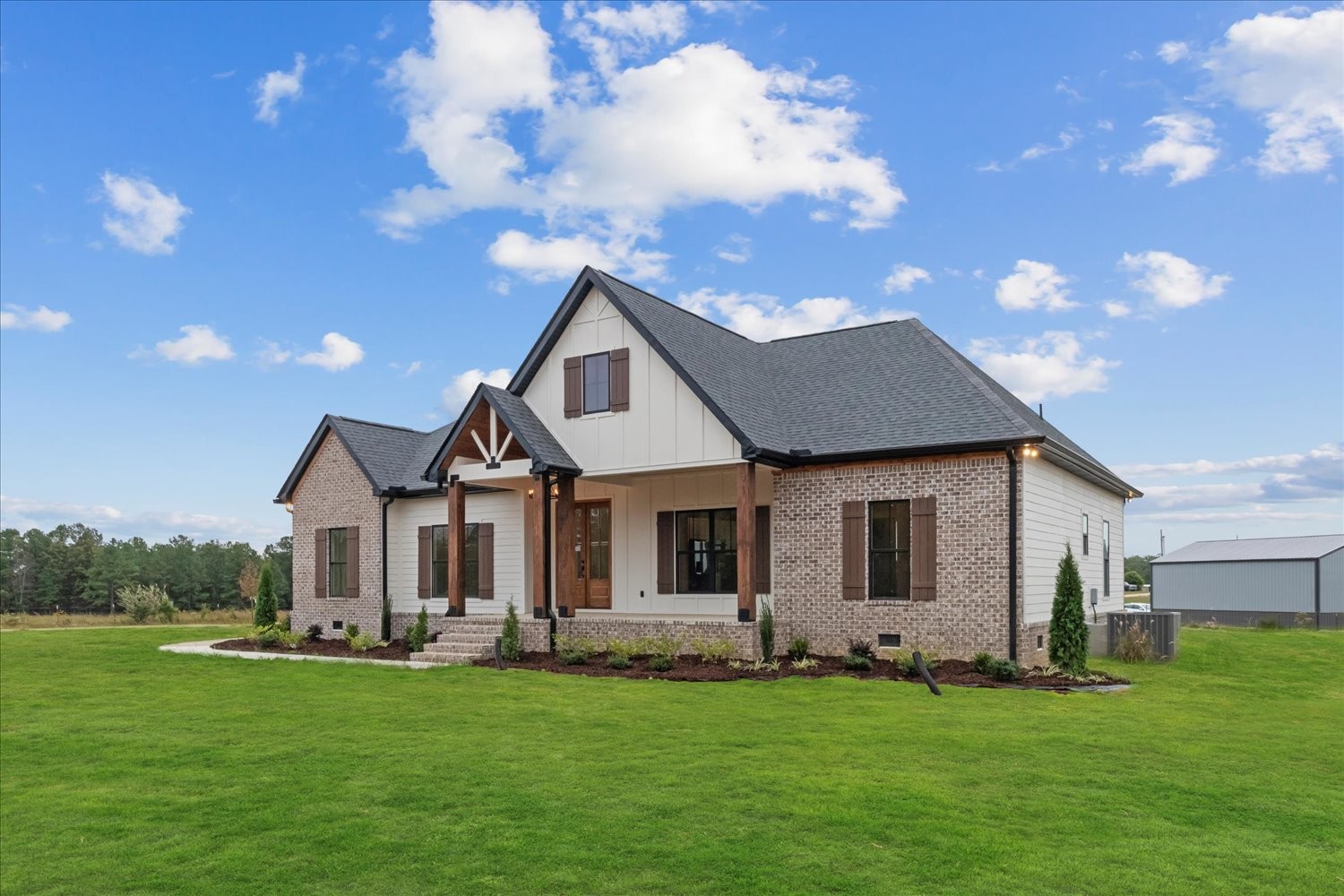 136 Summer Lk Drive Summertown, TN 38483 - Photo 4 of 48 a front view of a house with a garden