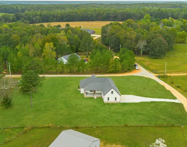 a view of a lake with a yard