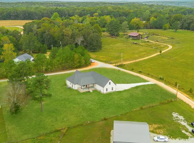 a view of a lake with a yard