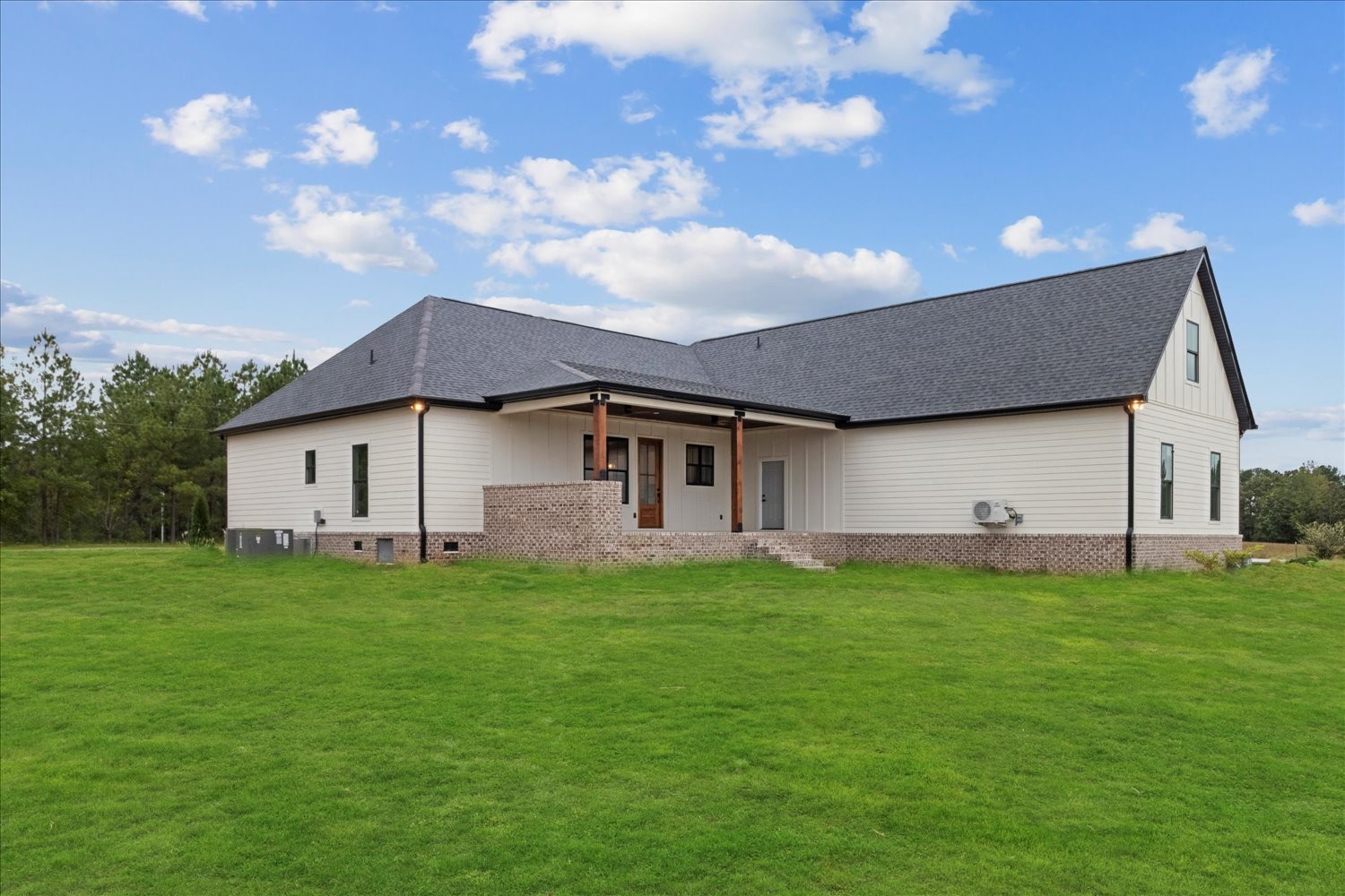 136 Summer Lk Drive Summertown, TN 38483 - Photo 6 of 48 a house that is sitting in the grass with large trees