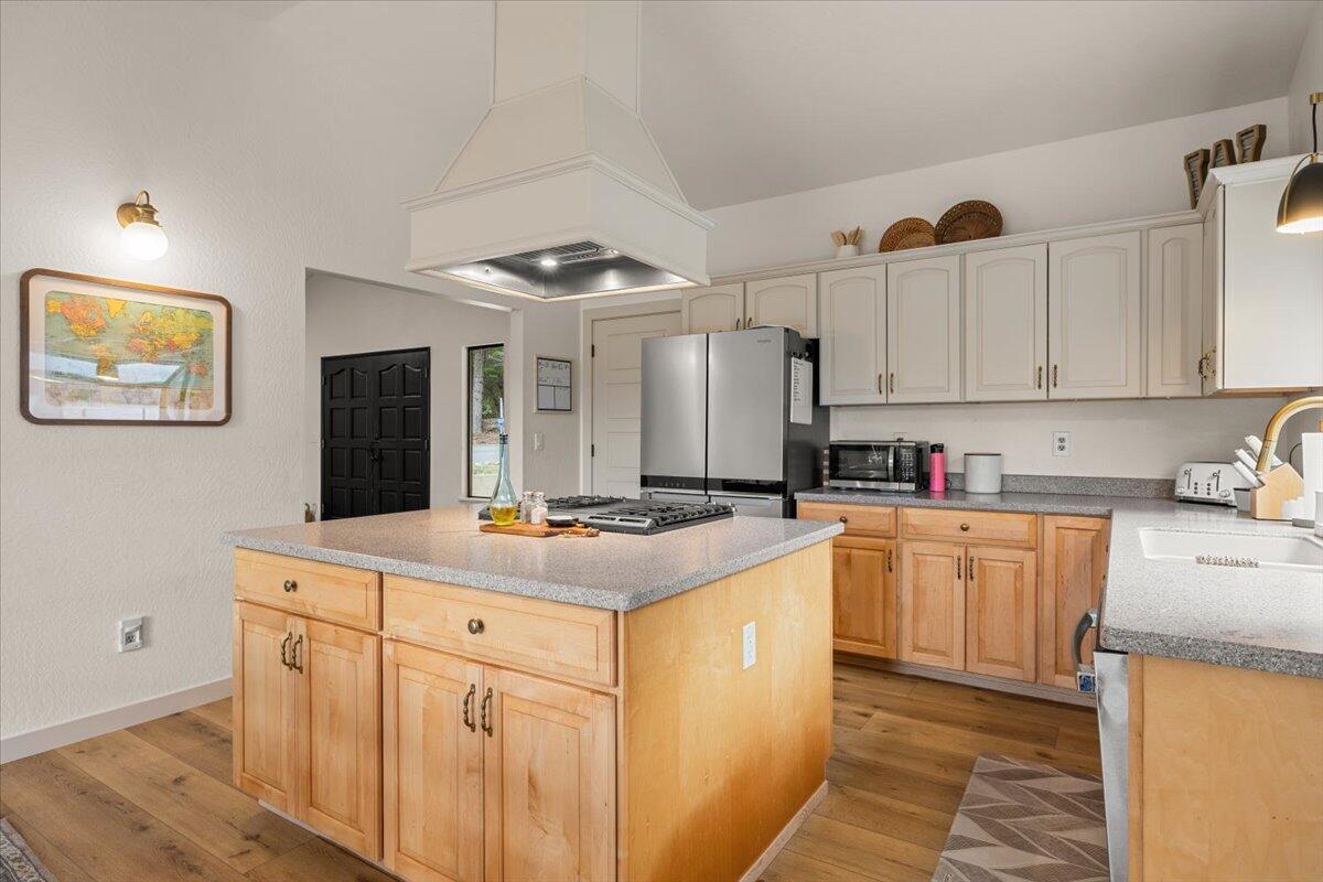 350 Splendor Drive Wilderville, OR 97543 - Photo 16 of 57 a kitchen with stainless steel appliances granite countertop a sink and cabinets