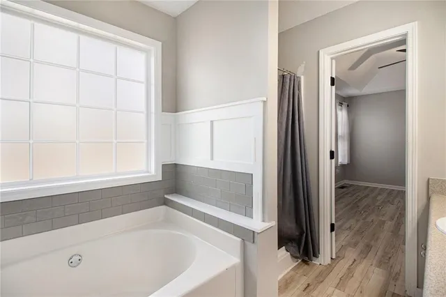 a view of an entryway with wooden floor