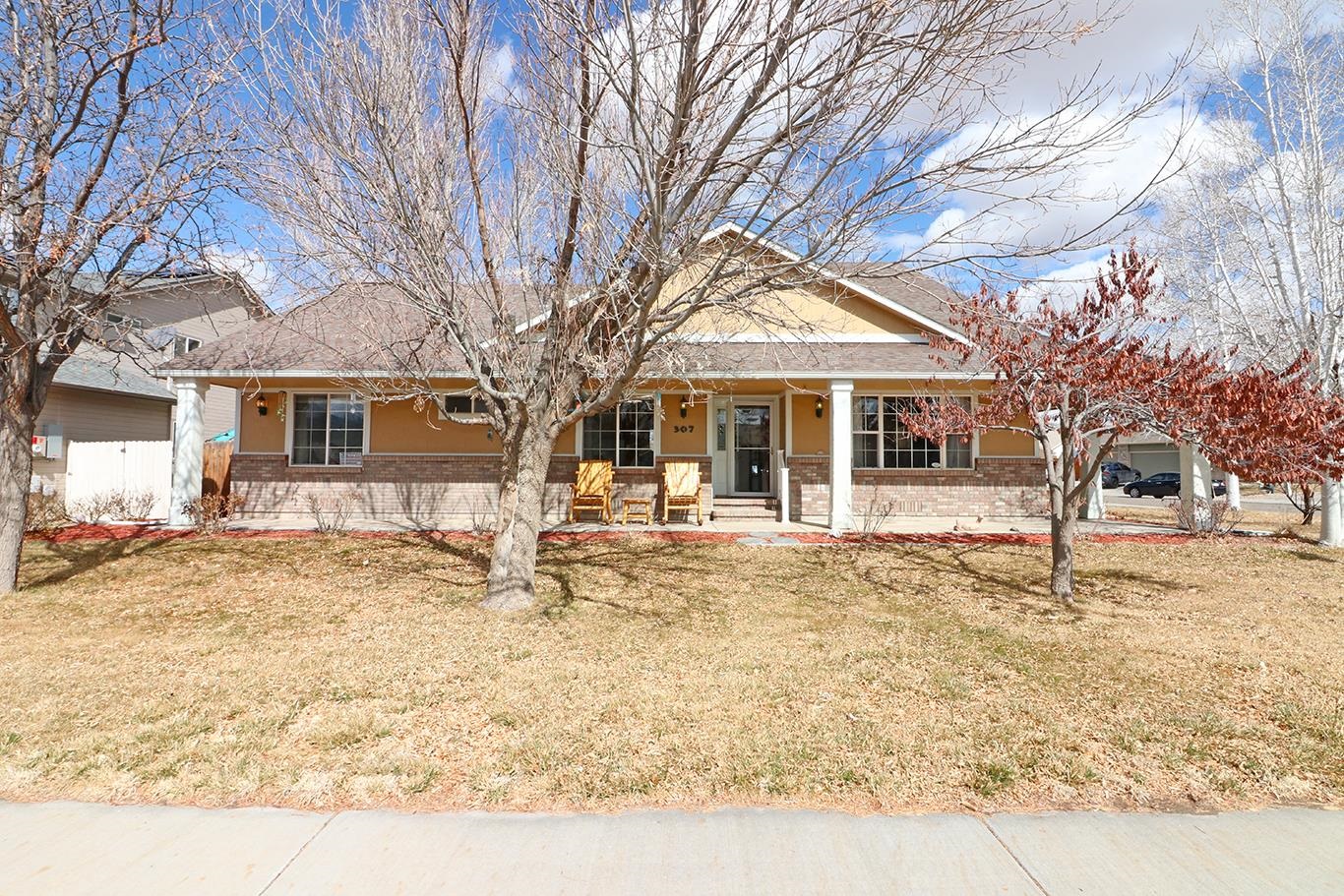 front view of a house with a yard
