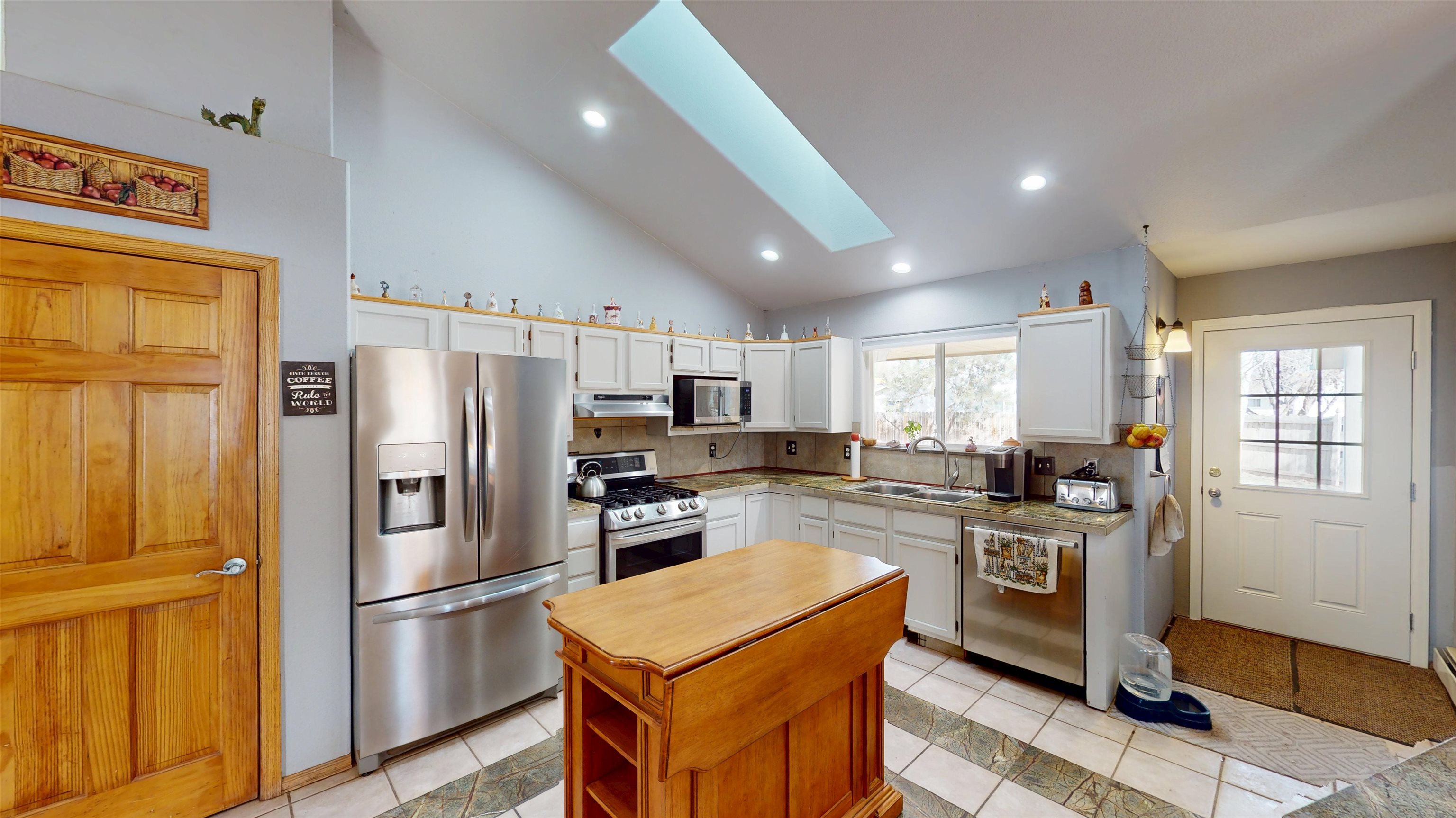 307 Elderberry Drive Fruita, CO 81521 - Photo 12 of 42 a kitchen with stainless steel appliances granite countertop a refrigerator stove and sink