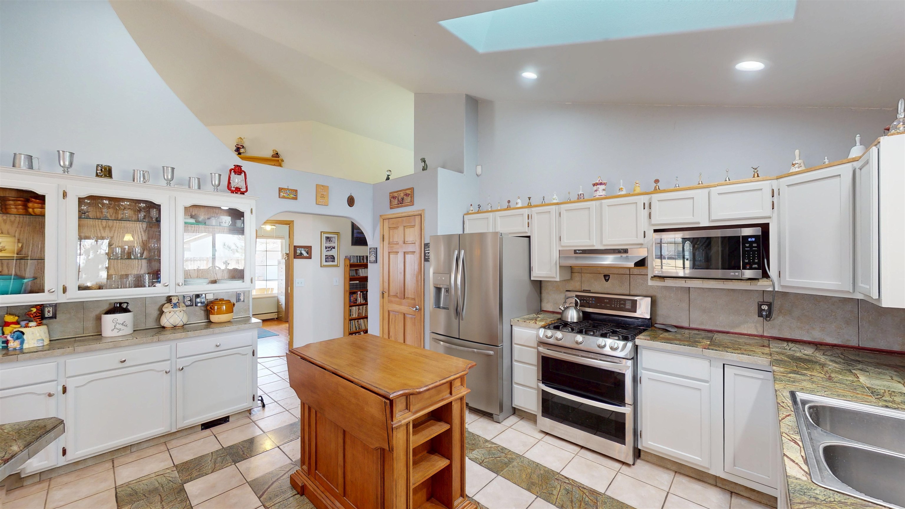 307 Elderberry Drive Fruita, CO 81521 - Photo 13 of 42 a kitchen with stainless steel appliances a stove a sink and a refrigerator