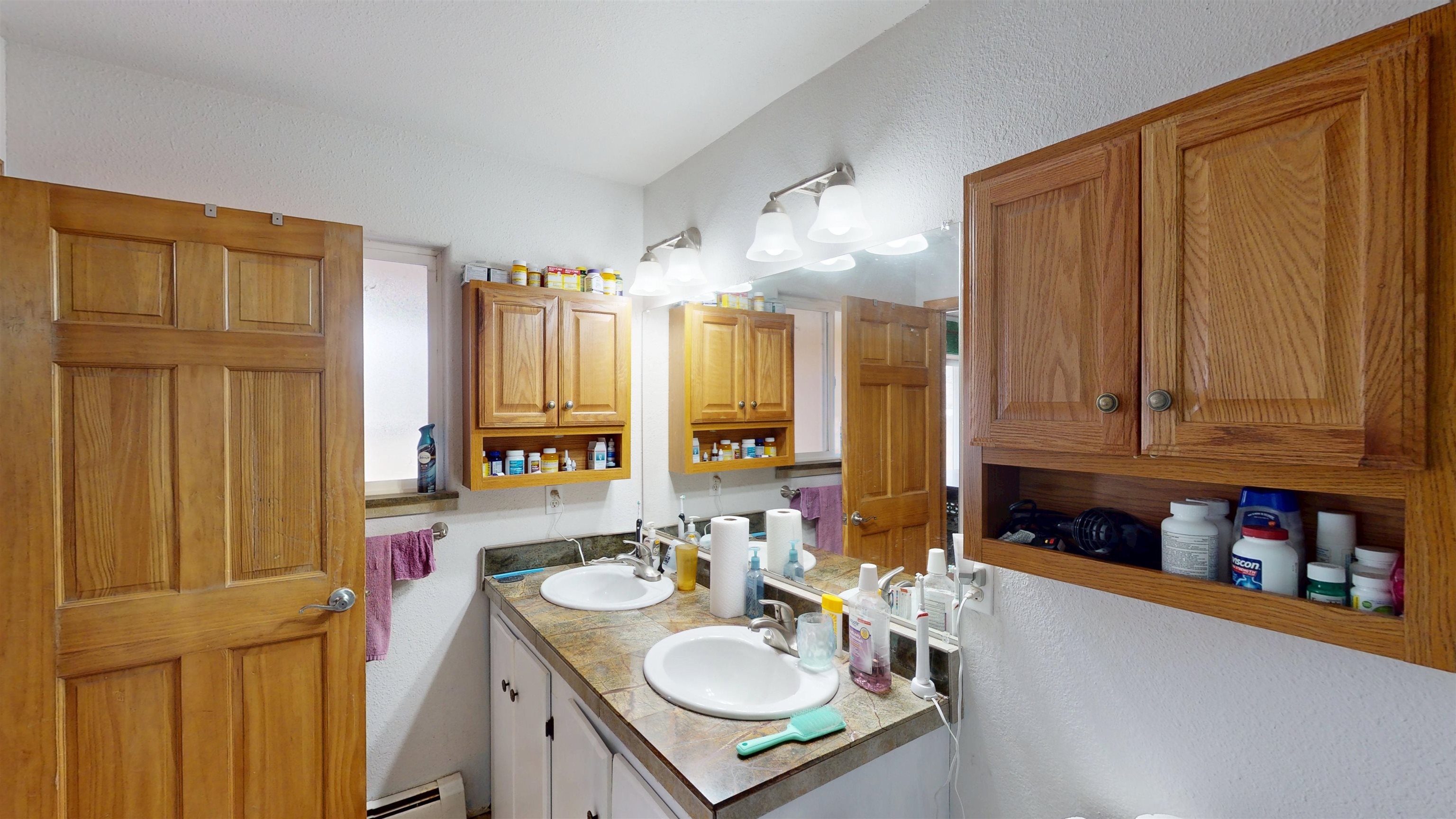 307 Elderberry Drive Fruita, CO 81521 - Photo 21 of 42 a bathroom with a sink double vanity and a mirror