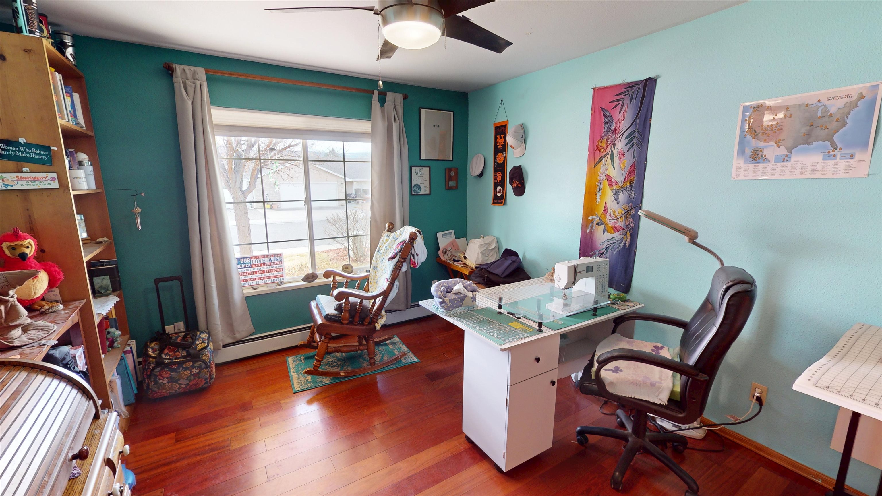 307 Elderberry Drive Fruita, CO 81521 - Photo 22 of 42 a view of a workspace with furniture and a window