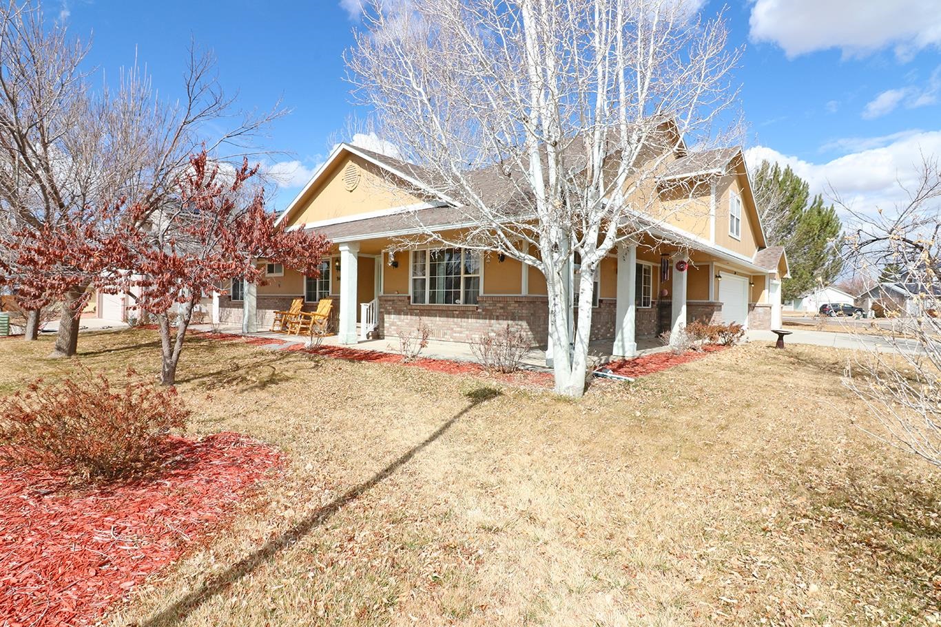 307 Elderberry Drive Fruita, CO 81521 - Photo 28 of 42 a view of house with a yard
