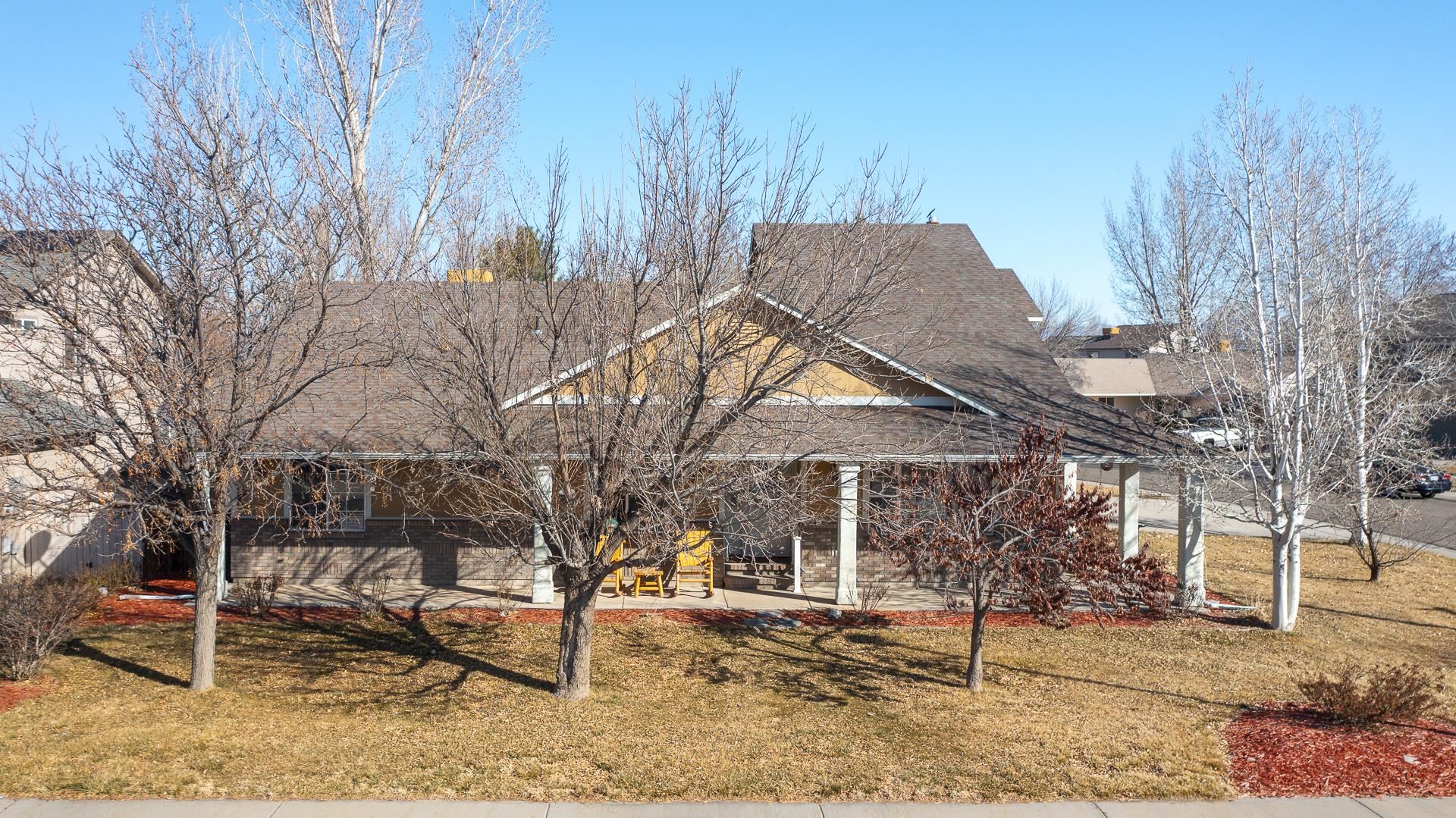 307 Elderberry Drive Fruita, CO 81521 - Photo 37 of 42 a backyard of a house with large trees