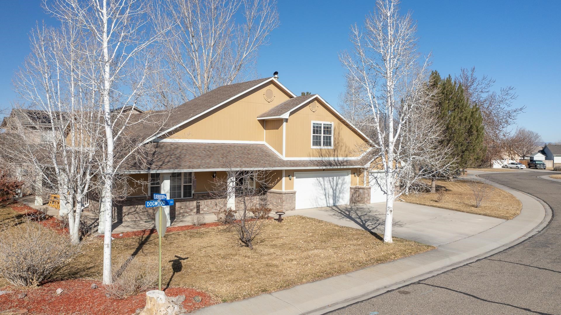 307 Elderberry Drive Fruita, CO 81521 - Photo 38 of 42 a front view of a house with a yard