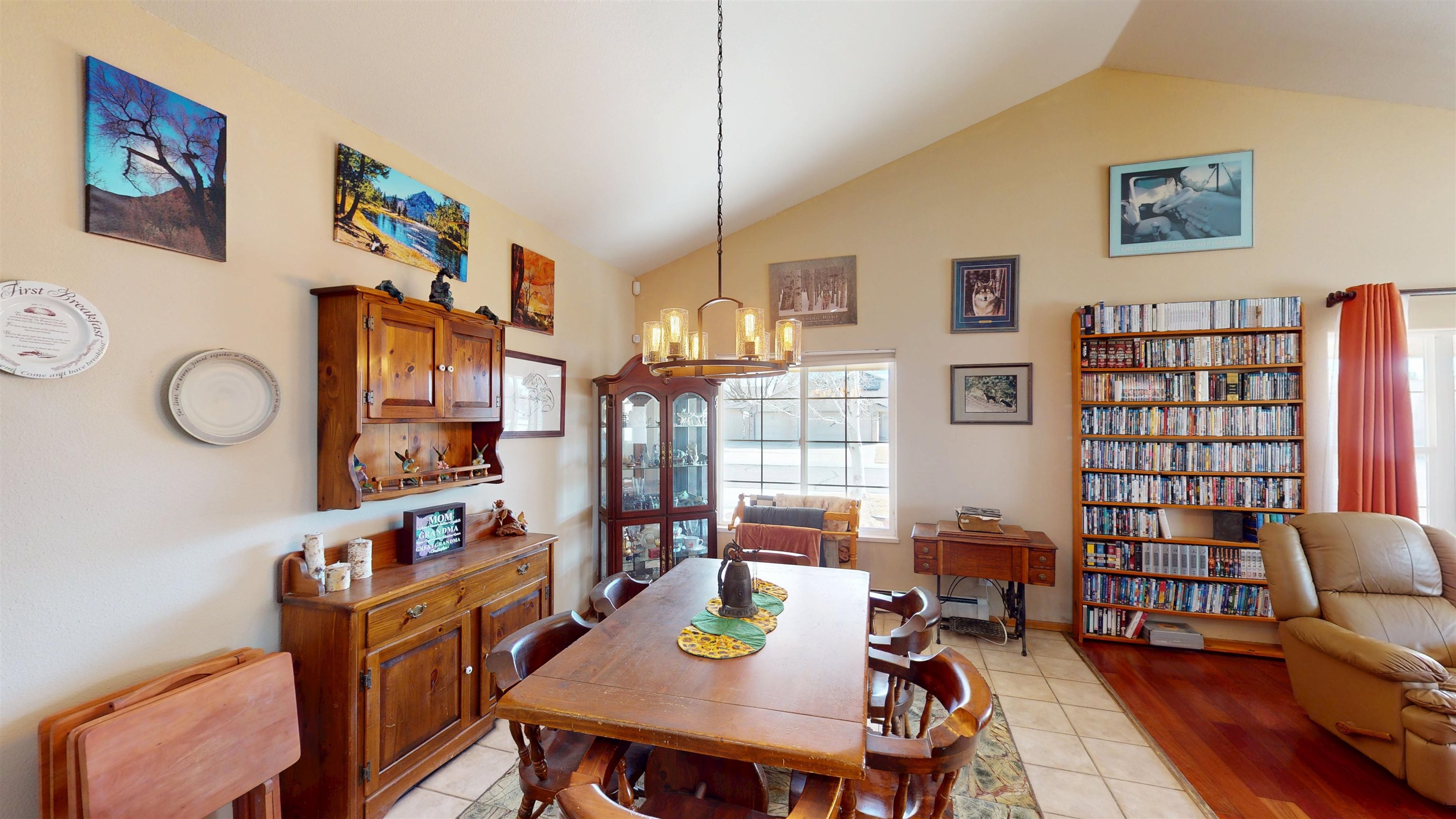 307 Elderberry Drive Fruita, CO 81521 - Photo 10 of 42 a view of a dining room with furniture and a book shelf