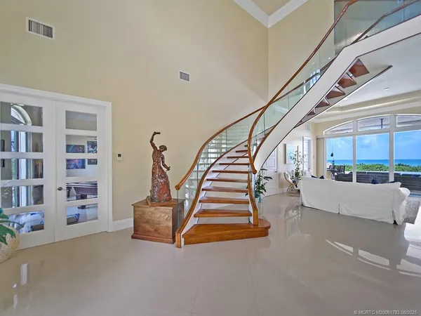a kitchen with stainless steel appliances kitchen island granite countertop a sink and cabinets