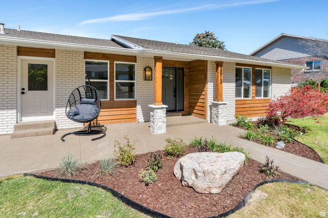 3813 North Foothill Drive Provo, UT 84604 - Photo 4 of 71 Contemporary ranch exterior featuring white brick siding and horizontal wood-finish accents