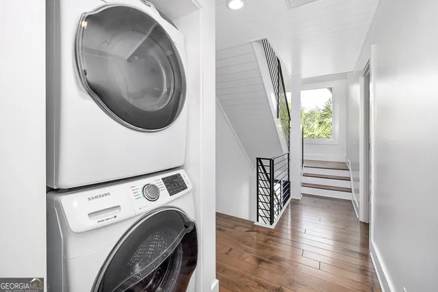 a view of a hallway with washer and dryer