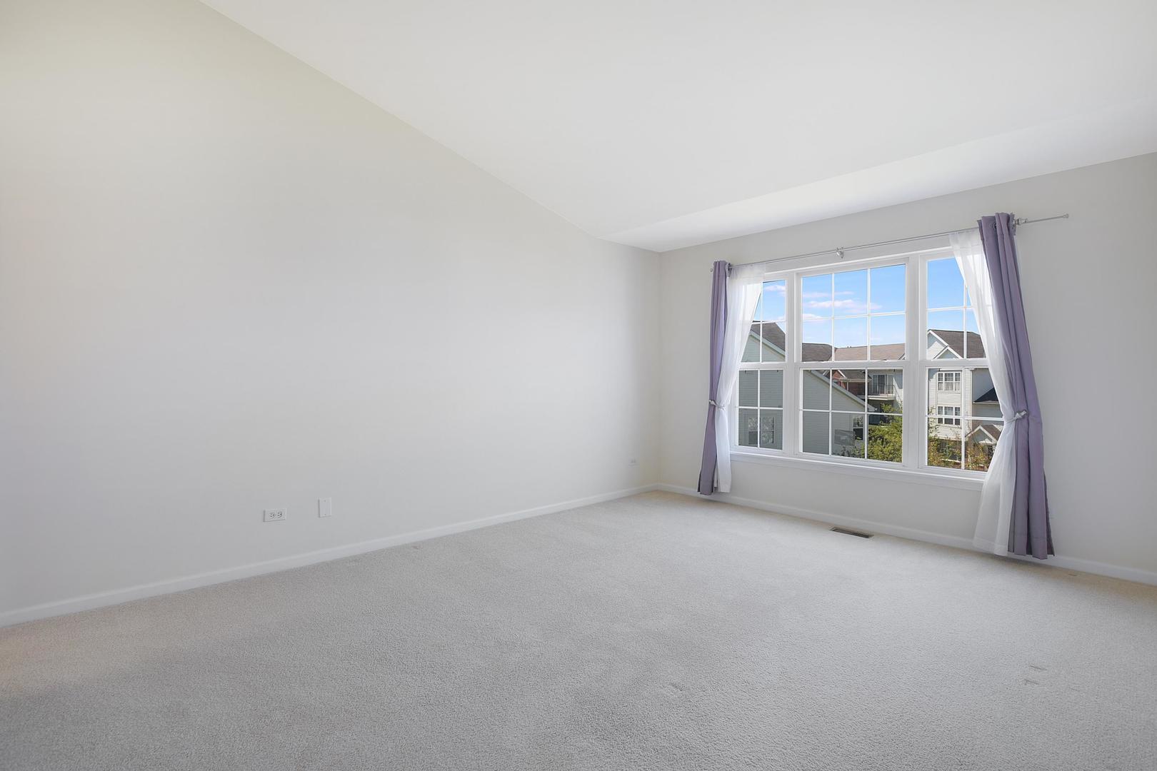 670 Mill Circle, Unit 3005 Wheeling, IL 60090 - Photo 16 of 22 an empty room with a window